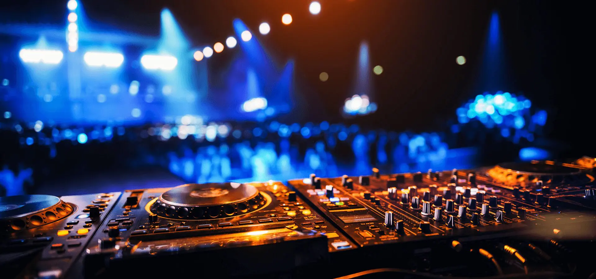 DJ equipment with colorful stage lights.